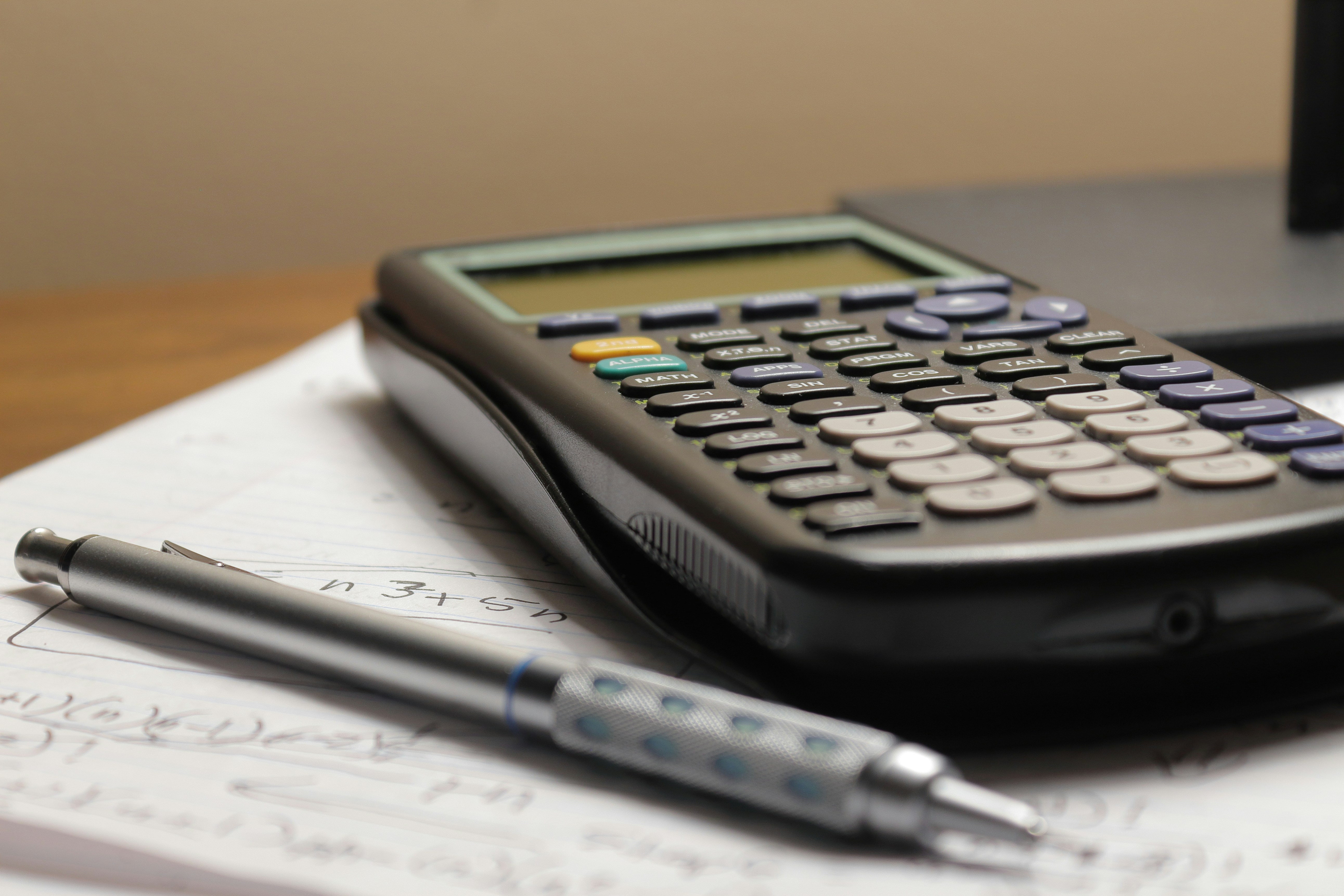 Calculator and maths notes ready for a grinds session